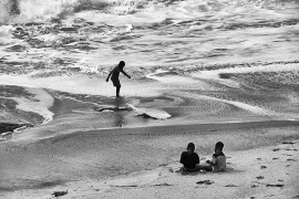Photo of three boys on a beach